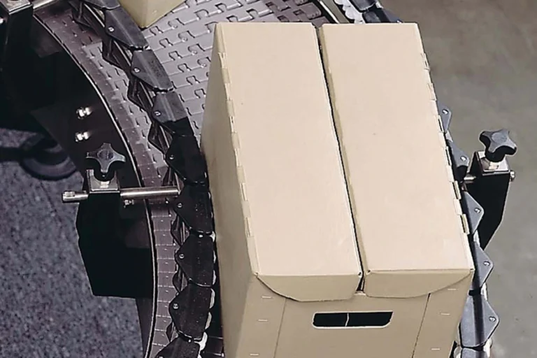 Regal Rexnord MatTop modular belt conveying cartons around a curve